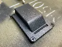 The WRAITH housing mounted with its retaining screw visible, shown from a side angle