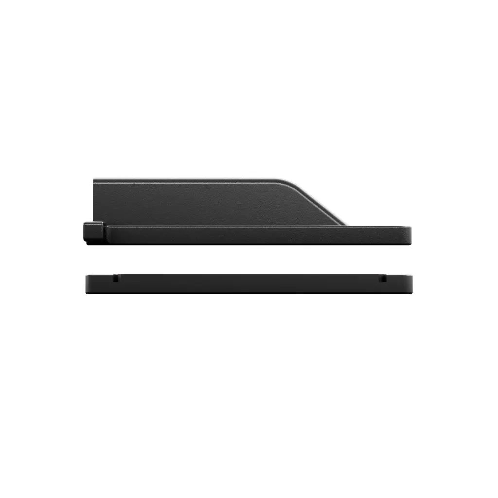 Side profile photo of the assembled WRAITH housing above its riser base, showing the low, slimline height of the kit